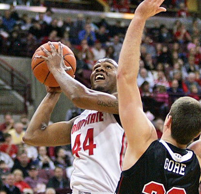 Ohio State's William Buford fights through VMI's defense for 23 points and six assists. (AP)