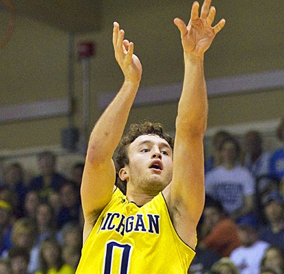 Michigan's Zach Novak scores on a 3-pointer en route to a career-high 22 points against UCLA. (AP)