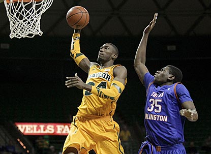 Bears forward Cory Jefferson (34) drives to the basket past Mavericks forward Brandon Edwards in the second half.  (AP)