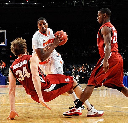 Syracuse's Kris Joseph battles through Cardinal defenders on his way to a game-high 18 points and an MVP crown. (Getty Images)