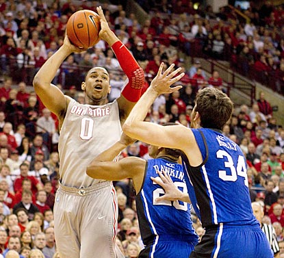 Jared Sullinger (21 points, eight rebounds) shoots over Duke's Andre Dawkins and Ryan Kelly (34).  (US Presswire)