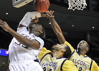 It's not easy for Ray Turner and the Aggies, but they manage to pull out their 64th consecutive non-conference home win. (AP)