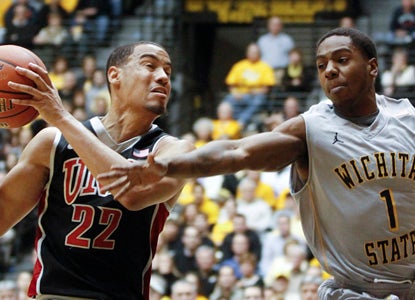 Joe Ragland (right) goes off for 31, including eight from downtown, to beat the previously undefeated UNLV Rebels at home. (AP)
