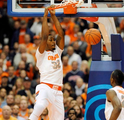 Kris Joseph does his work inside with 11 points and eight rebounds, and the Orange improve to 9-0.  (US Presswire)