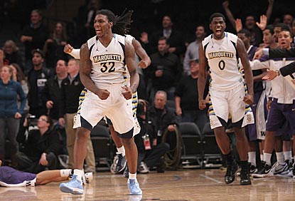 Jae Crowder (32) and Jamil Wilson react -- as do their opponents -- as time runs out moments after Crowder's go-ahead trey.  (US Presswire)