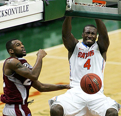 Gators' center Patric Young slams home two of his 12 points as Florida cruises by Rider.  (US Presswire)