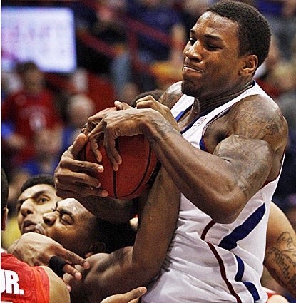 Kansas' Thomas Robinson takes the ball from Ohio State's Deshaun Thomas in the Jayhawks' 78-67 win. (AP)