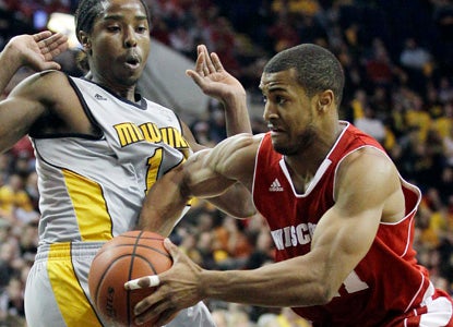 Wisconsin star Jordan Taylor goes for 14 points, including a key trey to help ice the game. (AP)