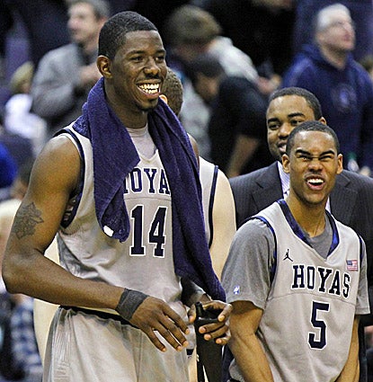 Henry Sims (left) and Markel Starks, who combine to score 35 points, enjoy Georgetown's win over American. (AP)