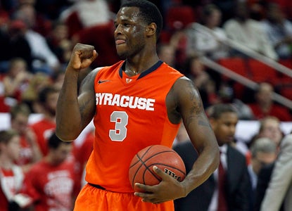 Dion Waiters scores a career-high 22 points to help his Orange beat a feisty Wolfpack on the road. (AP)