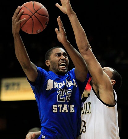 Steve McWhorter drives here for Indiana State, but his key contribution comes on defense against Vandy's John Jenkins. (AP)