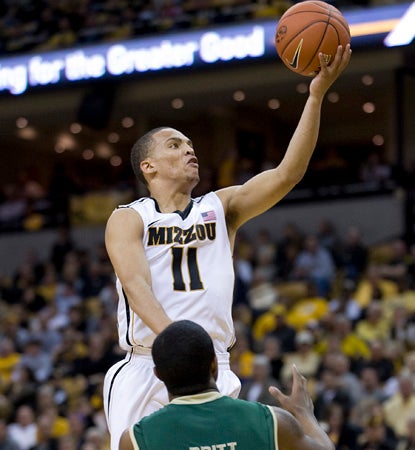 Michael Dixon goes off for two of his career-high 30 points to help wax William & Mary. (AP)