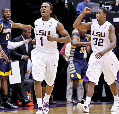 LSU guards Anthony Hickey and John Isaac celebrate the Tigers' win over No. 10 Marquette. (US Presswire)