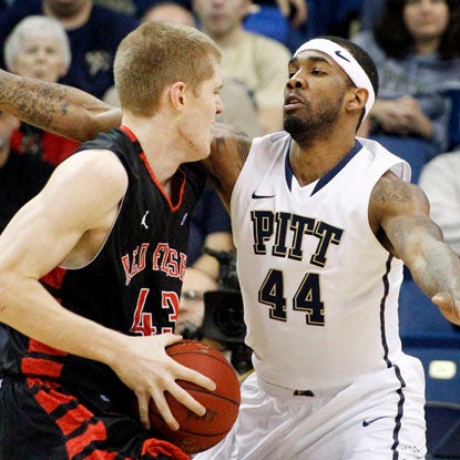 Pitt's J.J. Moore helps the Panthers clamp down on the Red Flash while also chipping in with 15 points.  (AP)