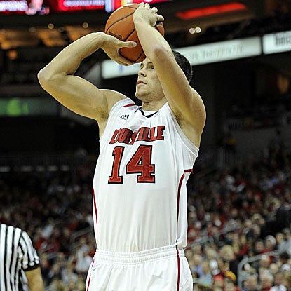 Kyle Kuric's jumper with 3:12 to play puts Louisville ahead for good and keeps the Cardinals undefeated. (US Presswire)