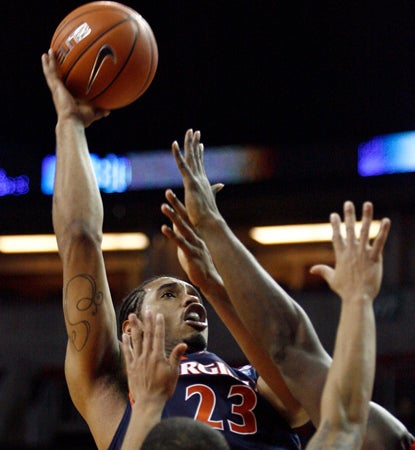 Mike Scott scores a career-high 33 points to help Virginia avoid an upset against Seattle. (Getty Images)