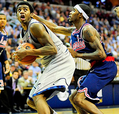 Georgetown's Hollis Thompson pushes against Memphis for 17 points and nine rebounds. (US Presswire)