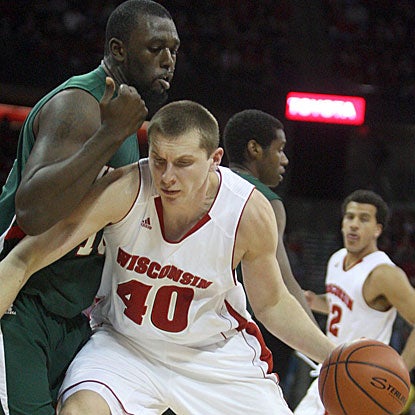 Wisconsin's Jared Berggren (right) drives to the hoop against MVSU's Amos Studivant in the Badgers' blow-out win. (US Presswire)