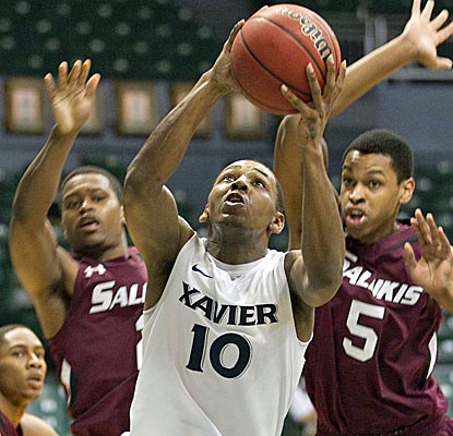 Mark Lyons notches a double-double with 17 points and 10 rebounds in a Xavier victory. (AP)