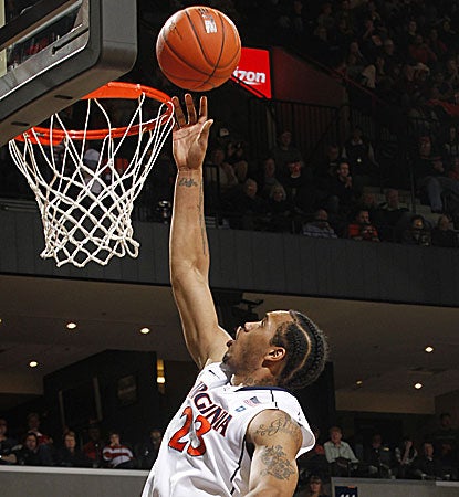 After spending most of the first half on the bench, Virginia's Mike Scott erupts for a game-high 17 points. (AP)