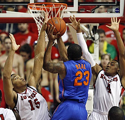 Derrick Randall, left, grabs eight rebounds in Rutgers' upset of No. 10 Florida.  (AP)