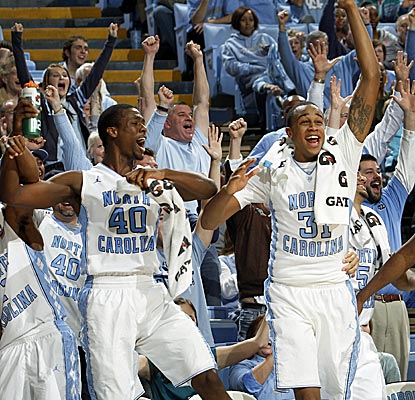 North Carolina's Harrison Barnes and John Henson react to the Tar Heels scoring their 100th point.  (AP)