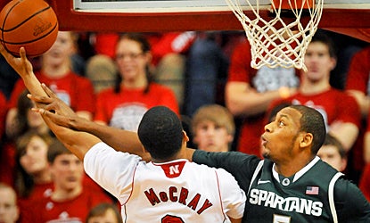 Adreian Payne and the Spartans' defense holds Nebraska to just 36 percent shooting. (AP)
