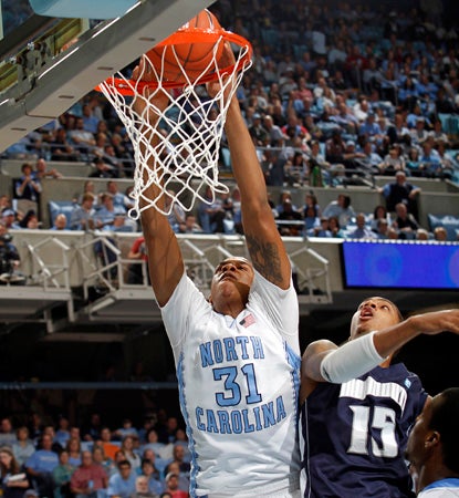 John Henson leads the No. 5 Tar Heels with 21 points en route to their 26th straight home win. (AP)