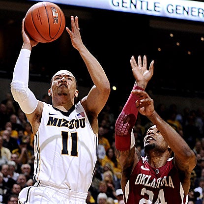 The Tigers' Michael Dixon (11) comes off the bench to contribute 13 points and four assists.  (US Presswire)