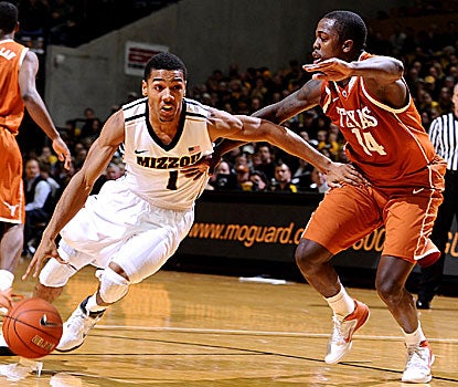 Phil Pressey (left) scores seven consecutive points during the second half to help Missouri hold off Texas. (US Presswire)