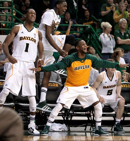 Perry Jones III (1) celebrates with teammates after his double-double helps Baylor blow OK State out of the building. (AP)
