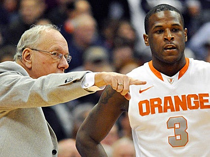 Syracuse coach Jim Boeheim gives Dion Waiters (12 points) instructions during the Orange's 78-55 win, Boeheim's 875th victory. (AP)