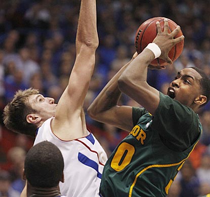 Kansas junior center Jeff Withey (10 rebounds, three blocks) consistently frustrates Quincy Miller and the Baylor front line.  (AP)