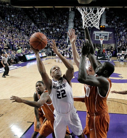 Rodney McGruder scores a career high 33 points to lead K-State over a scrappy Texas team. (AP)