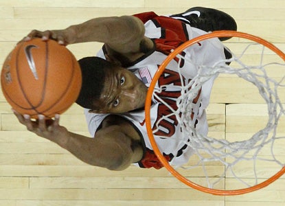 UNLV's Mike Moser dunks here for two of his 16 points, and adds 15 boards in a laugher over TCU. (AP)
