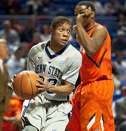 Tim Frazier gets around the Fighting Illini for 12 points, including the winning shot. (AP)