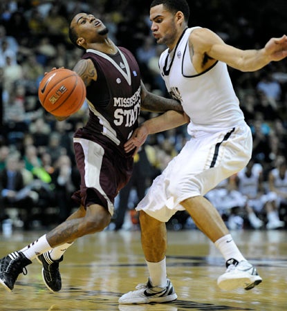 Dee Bost lays in the go-ahead layup with less than a minute left in OT.  He adds a game high 24 points to help edge Vandy. (AP)