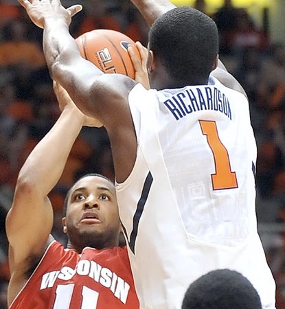 Wisconsin star big man Jordan Taylor leads the Badgers with 19 points in close one in Champaign. (AP)