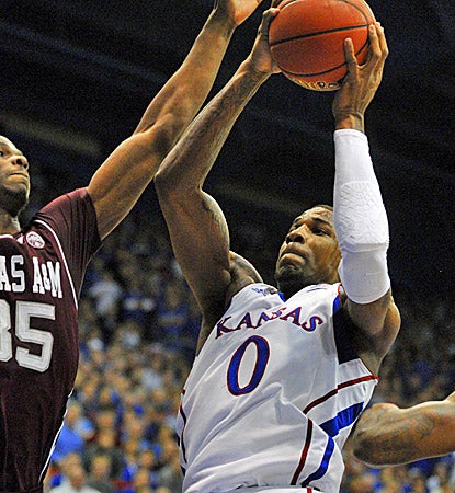 Kansas' Thomas Robinson (right) scores 16 of his 18 points in the second half to help the Jayhawks top Texas A&M. (US Presswire)