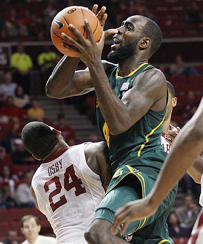 Baylor forward Quincy Acy collides with Oklahoma forward Romero Osby (24) as he goes up for a shot in the second half.  (AP)