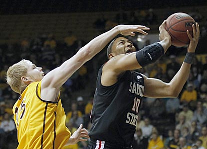 Despite an extended journey to Laramie, Tim Shelton and San Diego State muster the effort to get past Adam Waddell and Wyoming. (AP)