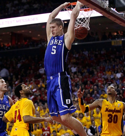 Mason Plumlee dunks here for two of his 23 points and adds 12 boards to help Duke beat Maryland. (AP)