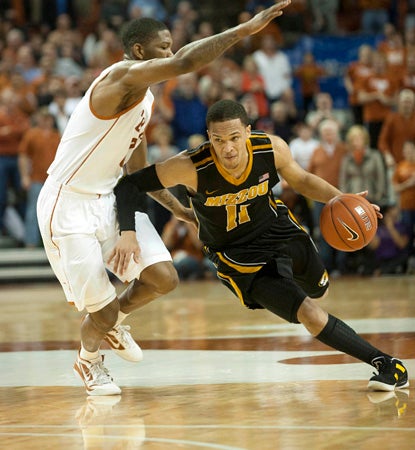 Michael Dixon scores a game-high 21 points, including the winning layup with 31 seconds left. (US Presswire)