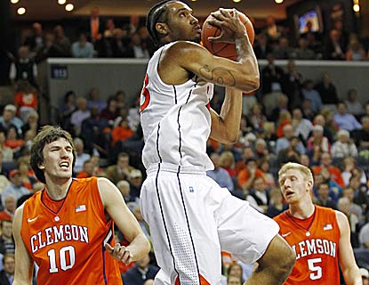Mike Scott carries Virginia with 23 points, including four free throws over the final 16.8 seconds to help hold off Clemson. (US Presswire)