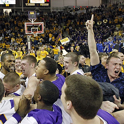 Northern Iowa fans storm the court following Anthony James' buzzer-beating basket to defeat No. 13 Creighton.  (AP)