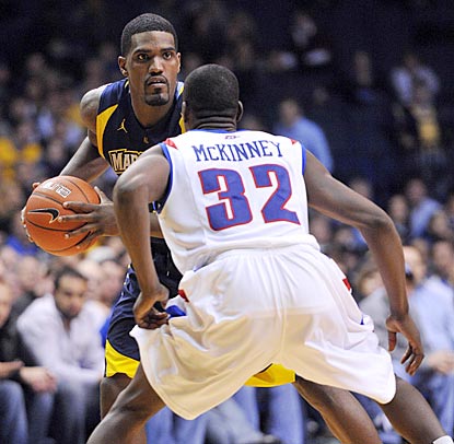 Darius Johnson-Odom, guarded by Charles McKinney, helps Marquette outscore DePaul by 25 in the final 24 1/2 minutes.  (US Presswire)