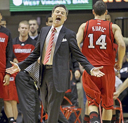 Rick Pitino gives the officials a piece of his mind; Kyle Kuric helps calm his coach with 17 points to rally Louisville.  (AP)