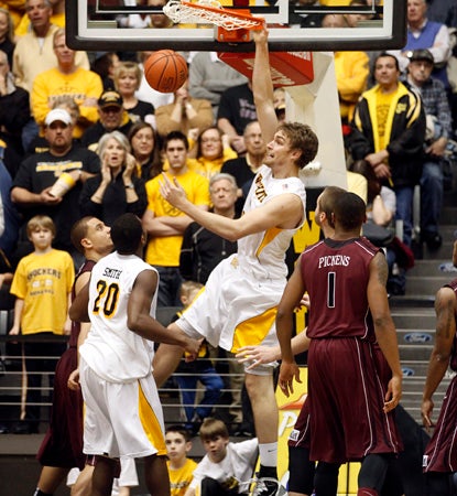Shockers' big man Garrett Stutz dunks here for two, but he does most of his damage from outside, hitting four treys. (AP)