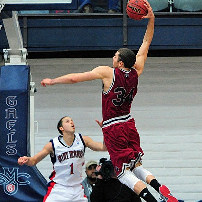 Drew Viney dunks over guard Jorden Page for a basket before finishing with 17 points for Loyola Marymount. (US Presswire)
