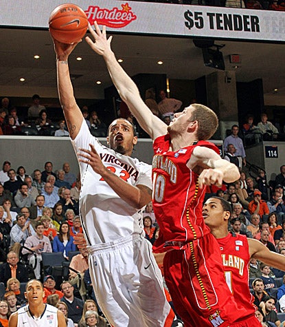 Virginia's Mike Scott (left) scores 25 points and grabs seven rebounds in a 71-44 win over Maryland. (AP)